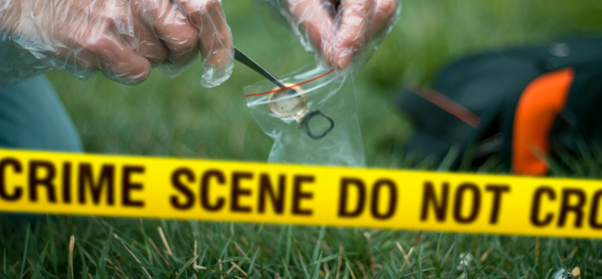 Forensic investigator placing evidence into a plastic bag behind yellow crime scene tape during an investigation linked to an attempted murder sentence in Canada case.